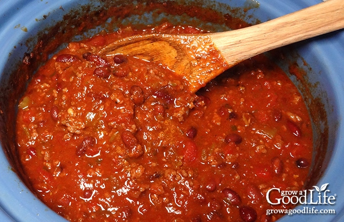 spoon stirring the chili