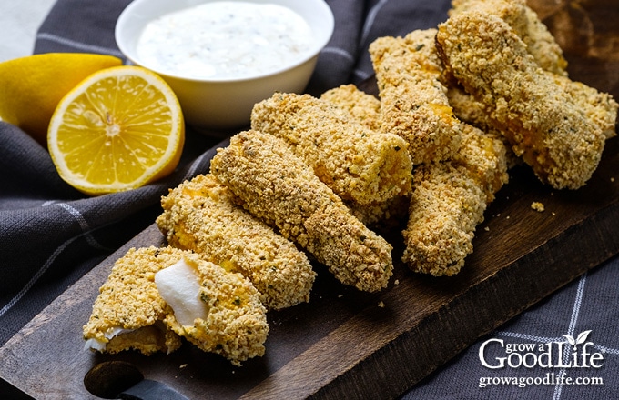 a pile of baked fish sticks on a table