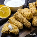 a pile of baked fish sticks on a table