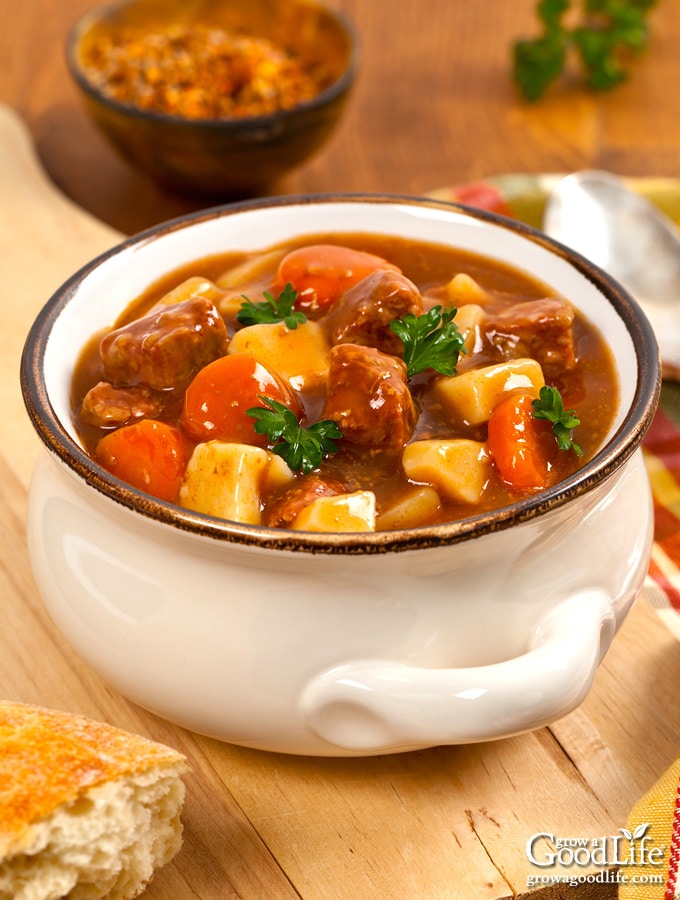 white bowl of beef stew on a table