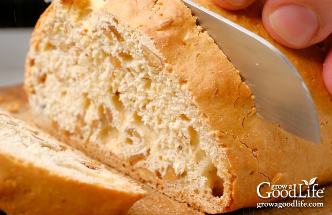 Cutting the loaf into slices.