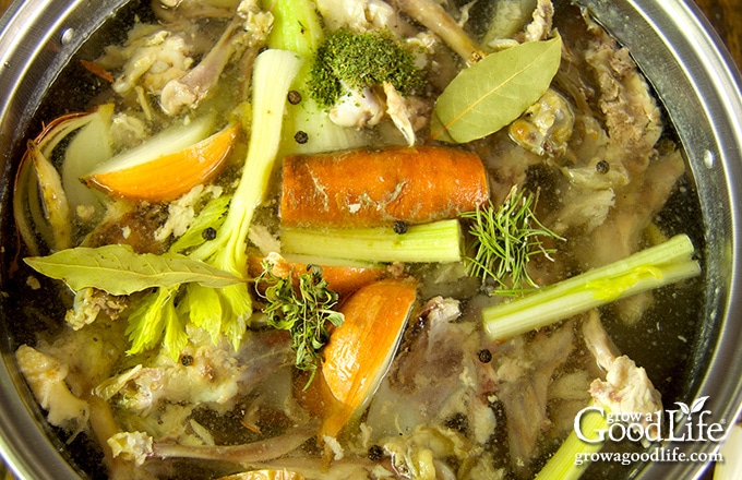 over head image of chicken stock simmering