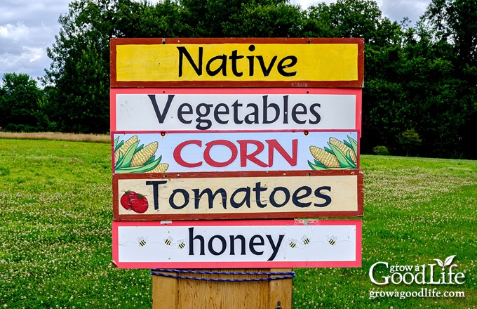 farm stand sign announcing corn is available