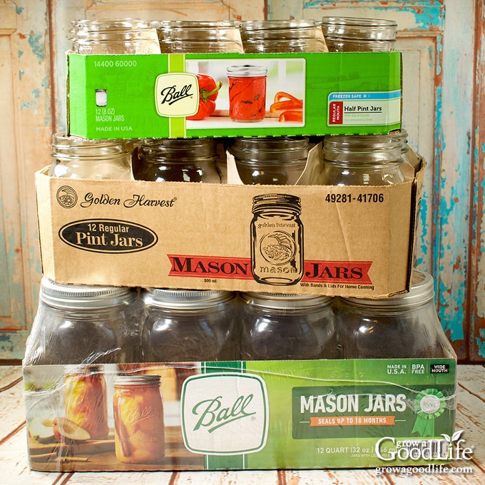 cases of canning jars stacked on a table