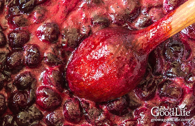 closeup of cherries simmering into jam