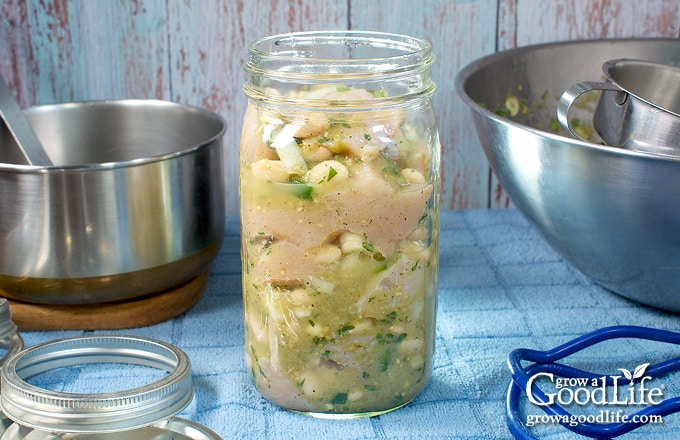 Raw packing the ingredients in a jar.