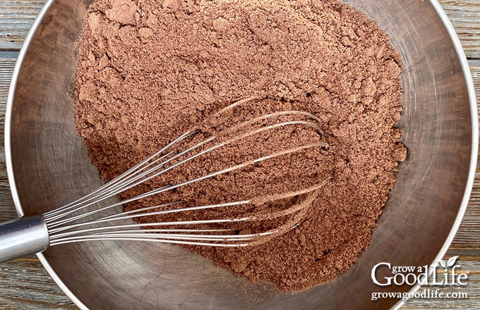 dry ingredients for making chocolate crinkle cookies in a bowl