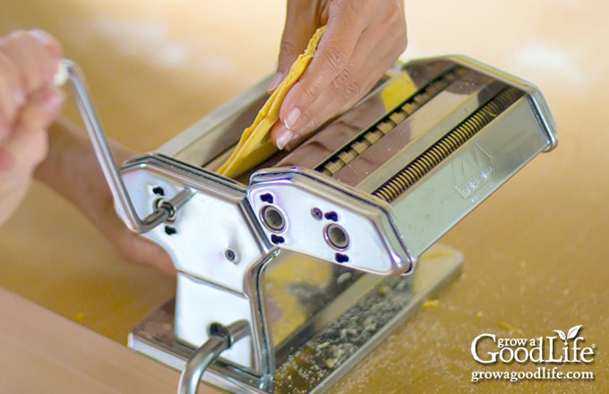 running the dough through a manual pasta machine