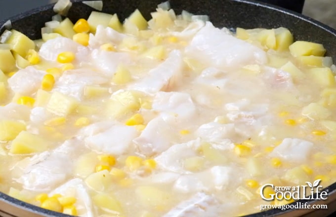 add cod and corn to the pot and simmer until fish is cooked