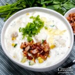 closeup of a bowl of fish chowder on a table