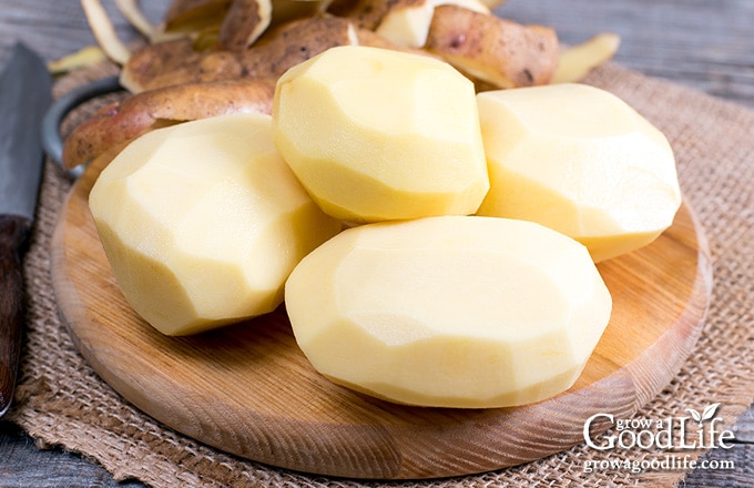 peeled potatoes on a table