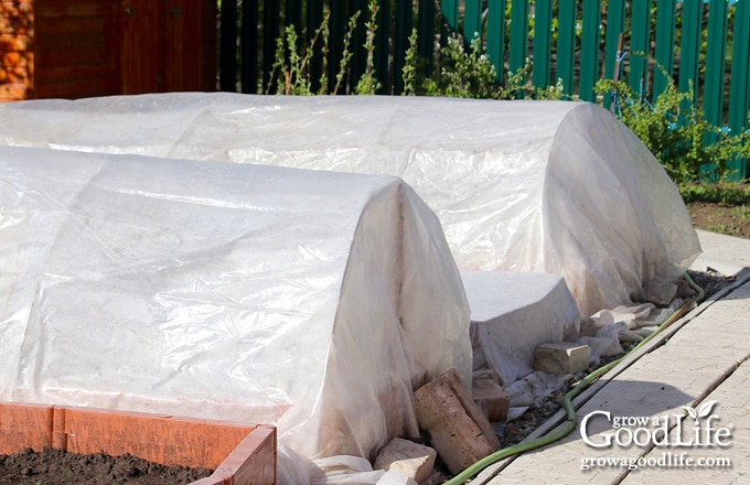 hoop house over a raised bed garden