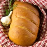 This garlic rosemary bread recipe has a whole head of roasted garlic baked into the dough. Oven roasting mellows the flavor of garlic and the soft, roasted cloves vanish into the bread dough giving you a mild garlic flavor with each and every bite.