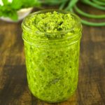 A slight twist from your regular pesto, this recipe combines garlic scapes with lemon balm for an early garden fresh variation. Spoon this garlic scape lemon balm pesto on pasta, seafood, and even sandwiches.