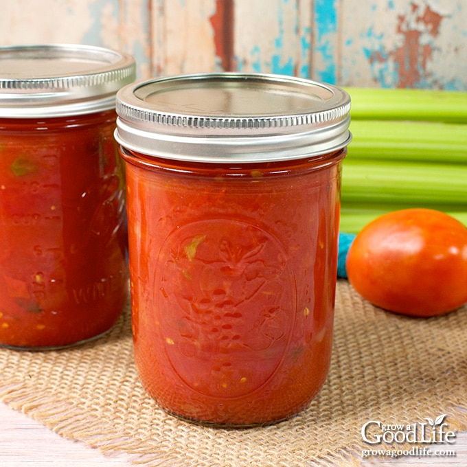 Jars of home canned stewed tomatoes on the counter.