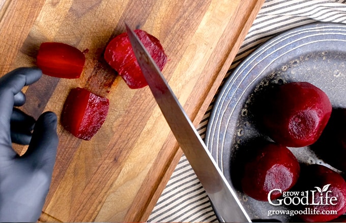 Cutting the beets into smaller pieces.