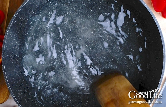 Overhead view of a pot of pickling brine.