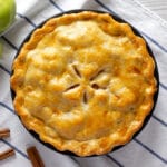 overhead photo of a pie on a blue striped towel