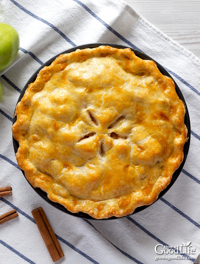 overhead photo of a pie on a blue striped towel