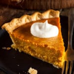 Slice of pumpkin pie on a table