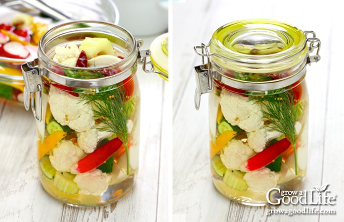 filling a jar of mixed vegetables with pickling brine