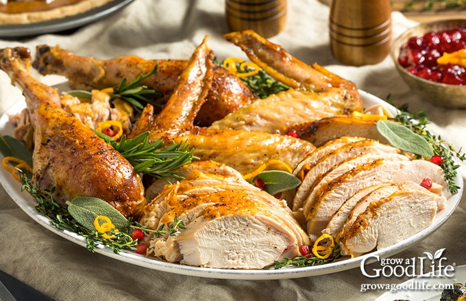 platter of carved turkey on a table