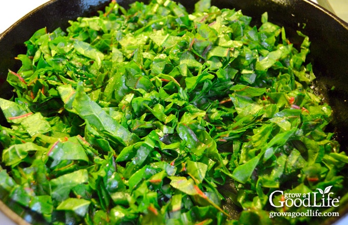 cooking beet greens in a skillet