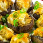 These garlic and cheddar stuffed mushrooms are a great appetizer for parties, cocktail hour, or game day. Baby bella mushrooms filled with garlic and cheddar stuffing and topped with cheddar cheese. Try this garlic and cheddar stuffed mushrooms recipe for a flavorful, bite-sized appetizer!