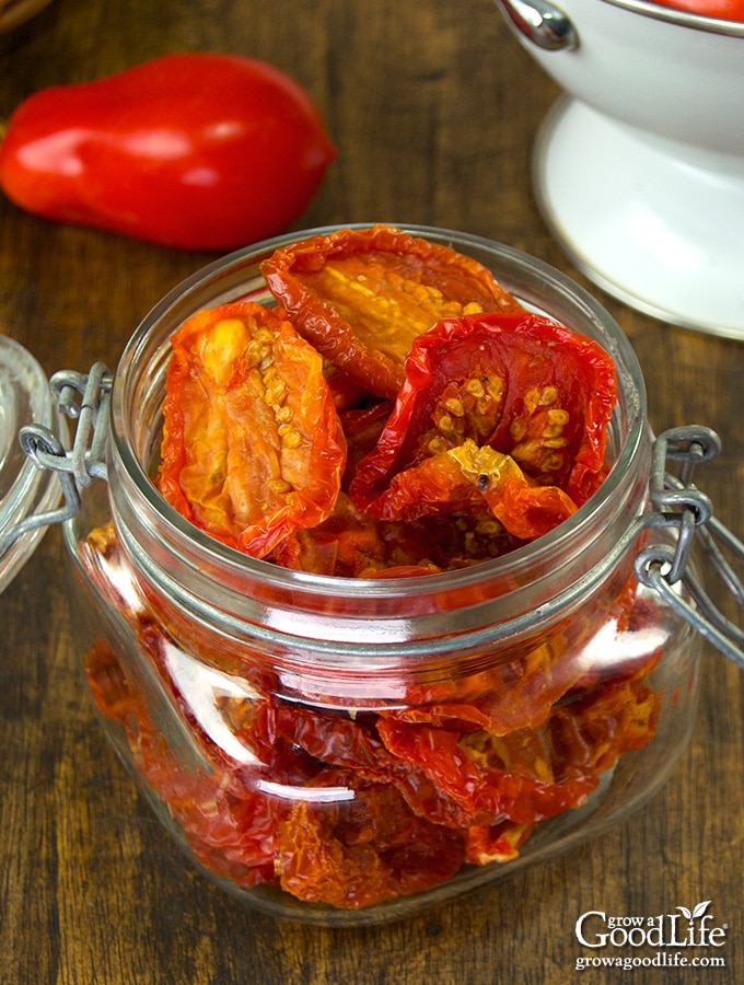 No sunshine required to make these homemade sun dried tomatoes. Drying tomatoes is a great way to preserve the harvest and save storage space. 20 pounds of tomatoes will reduce down to about one pound of sun dried tomatoes.