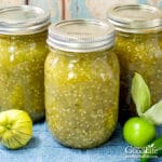 jars of tomatillo salsa verde on a blue towel