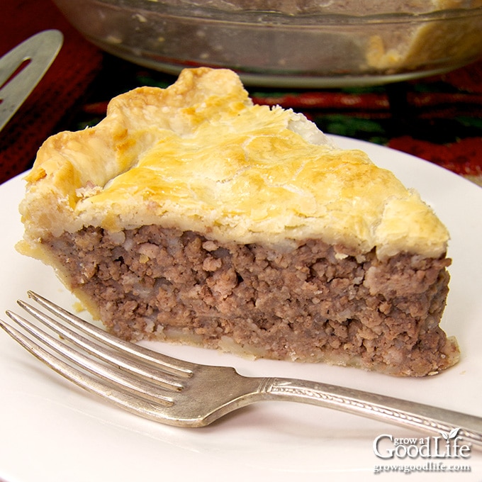 slice of tourtiere meat pie on a white plate