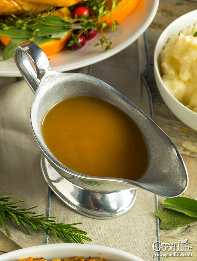 turkey gravy in a gravy boat on a table