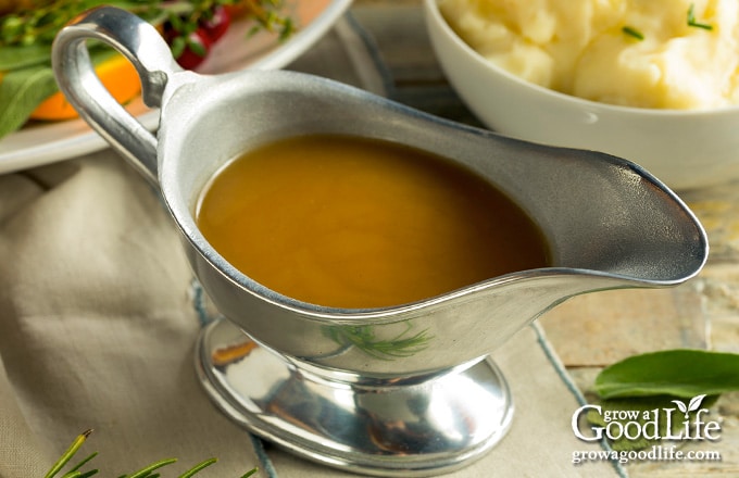 turkey gravy in a gravy boat on a table