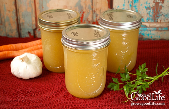 jars of home canned turkey stock on a table