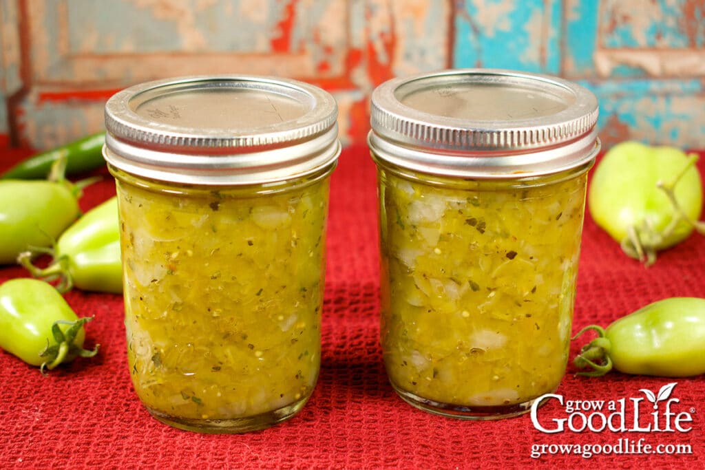 Two jars of green tomato salsa verde