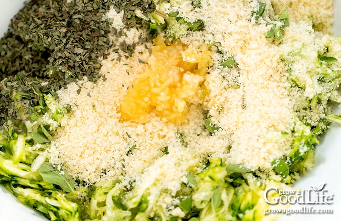 overhead photo of zucchini fritter ingredients in a bowl