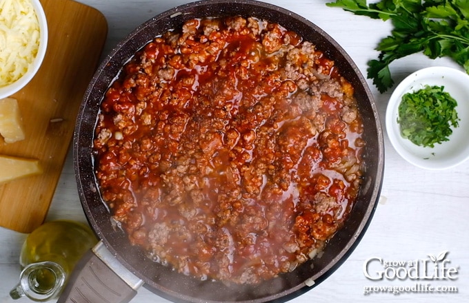 cooking meat sauce in a skillet