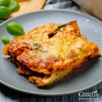 piece of zucchini lasagna on a grey plate