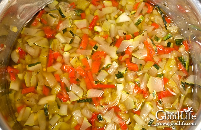 Overhead view of zucchini ingredients in a pot.